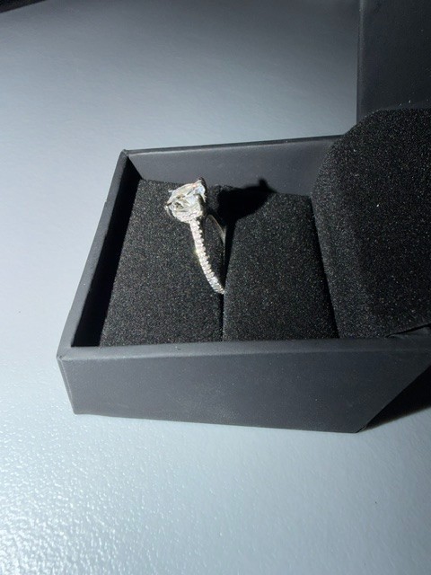 2.02 carat diamond ring. Round Brilliant single diamond, diamonds around band.