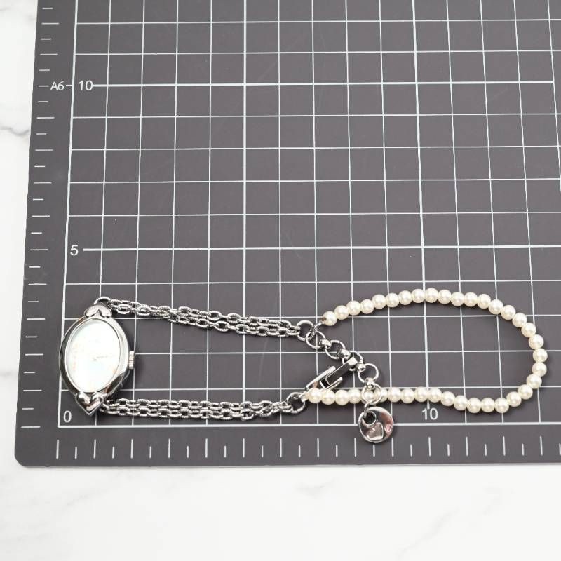 sara ladies’ wristwatch pearl bracelet watch oval shell dial heart motif silver