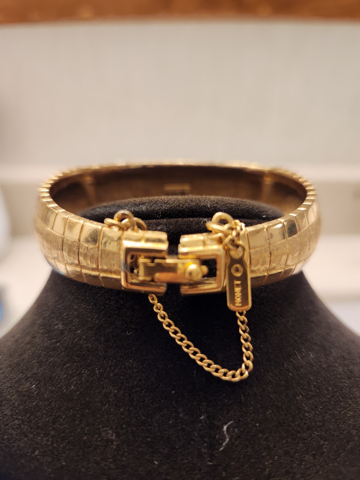 Monet gold tone bracelet with safety chain w/shiny and matte finish
