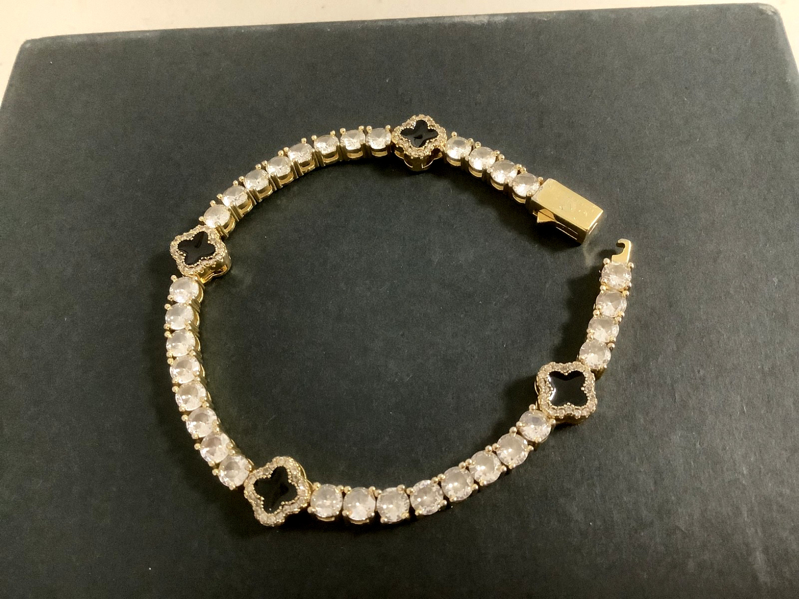 Imperium 18k gold plated CZs four leaf clover black enamel tennis bracelet 7″