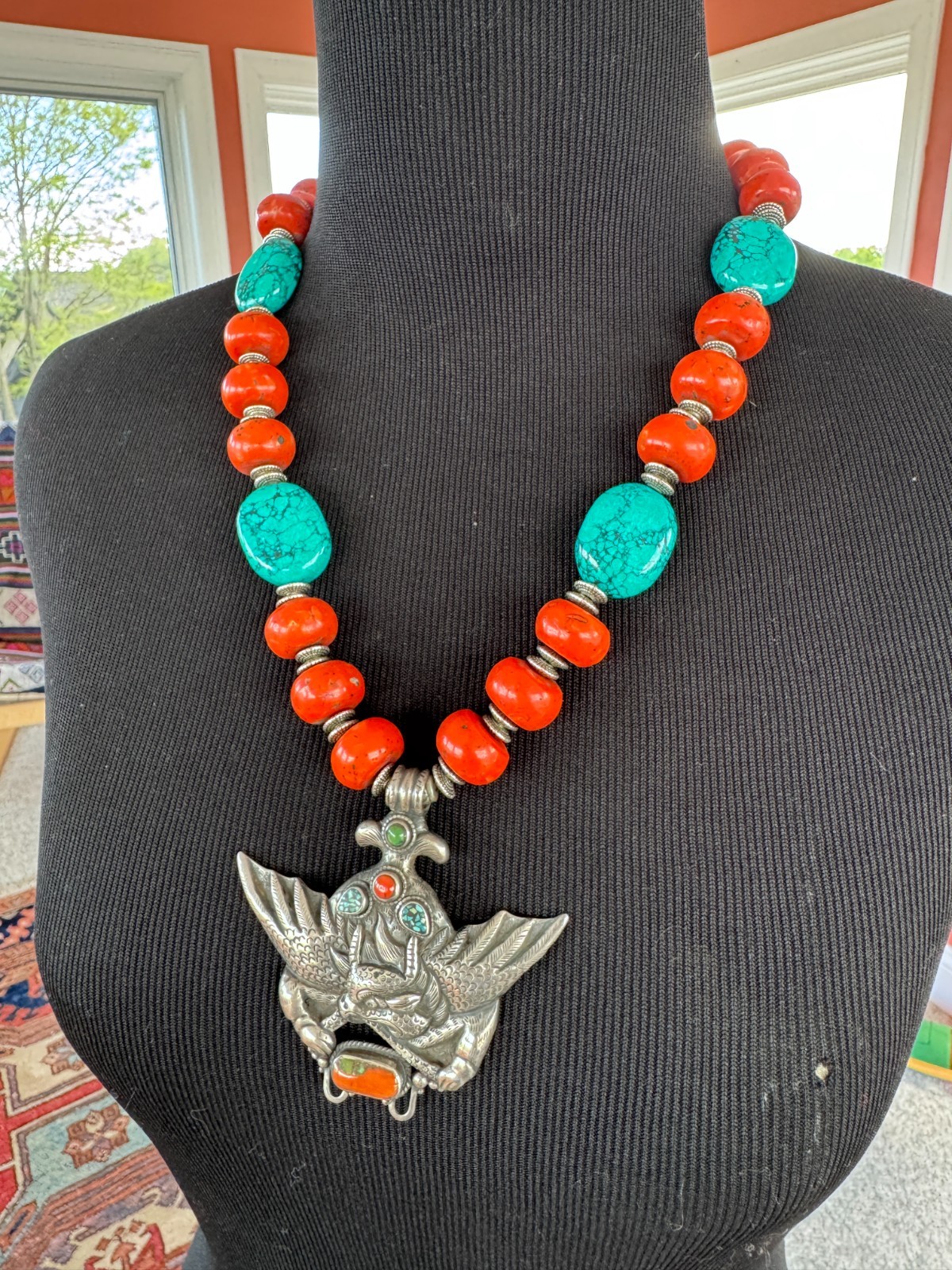Silver Garuda pendant strung with natural coral and turquoise