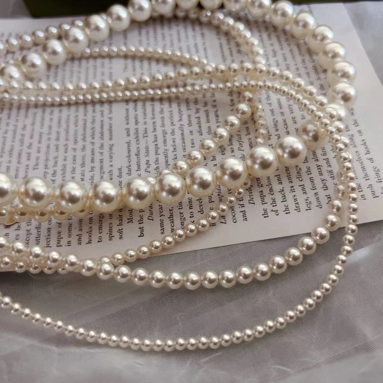 650 Warm White Perfectly Round High-Intensity Pearl Necklace
