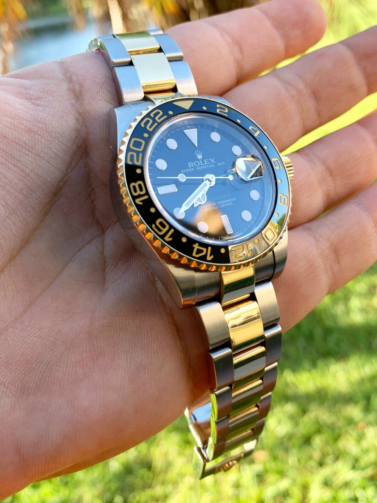 Rolex GMT-Master II Two Tone Gold Ceramic Bezel Black Dial Bidirectional Bezel