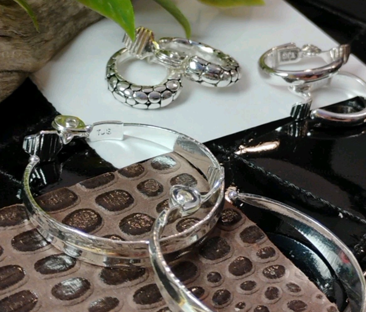 The JEWELRY GROUP TJG Set of THREE (3) Silver Toned Hoop Clip On Earrings!