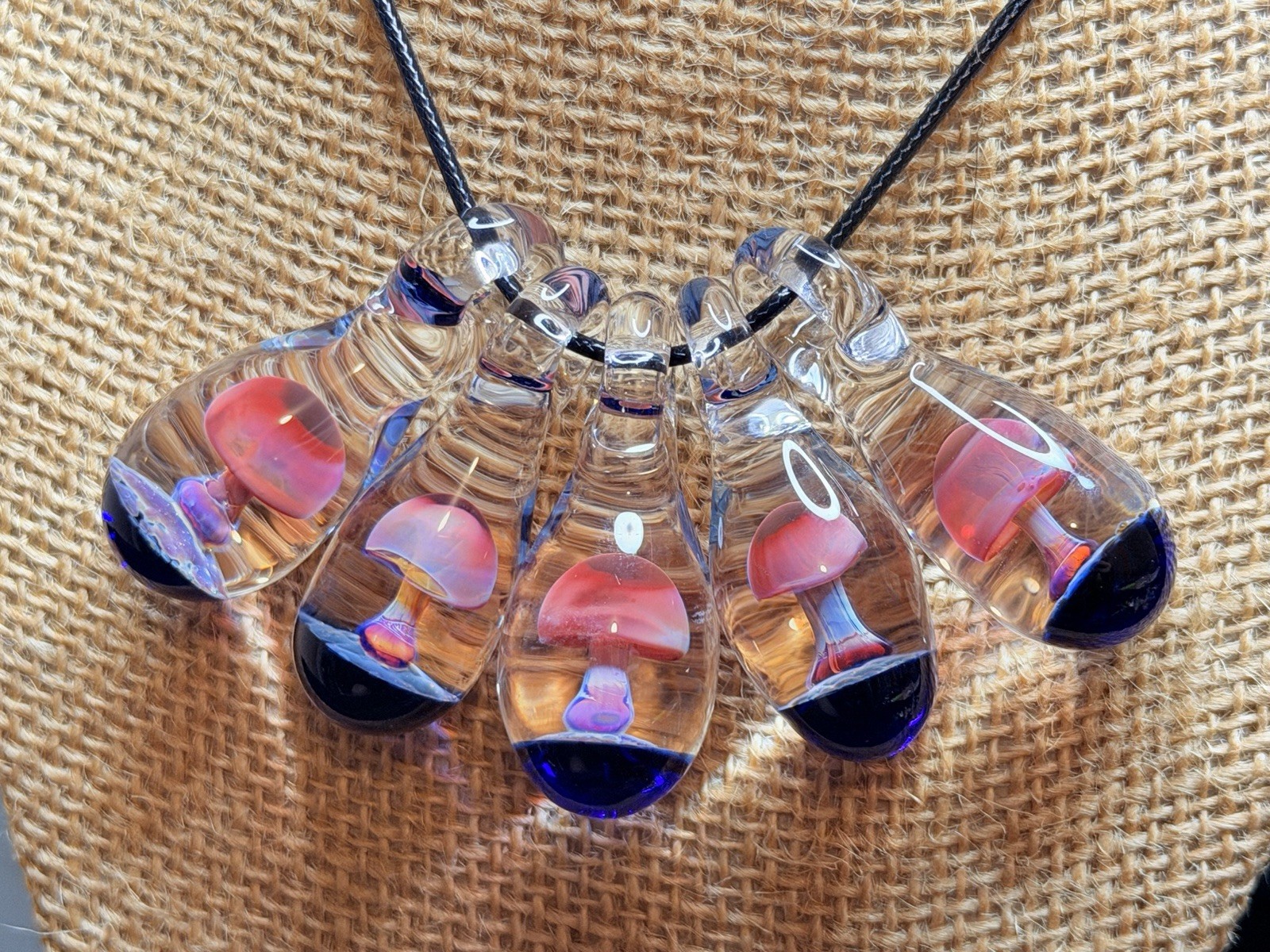 Glass Teardrop Mushroom Pendant in reds and purples with cobalt blue base