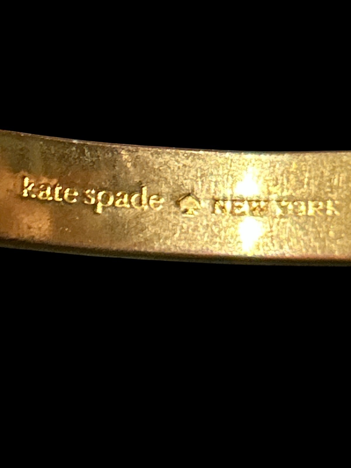 Kate Spade Black and gold Bangle Oval shape
