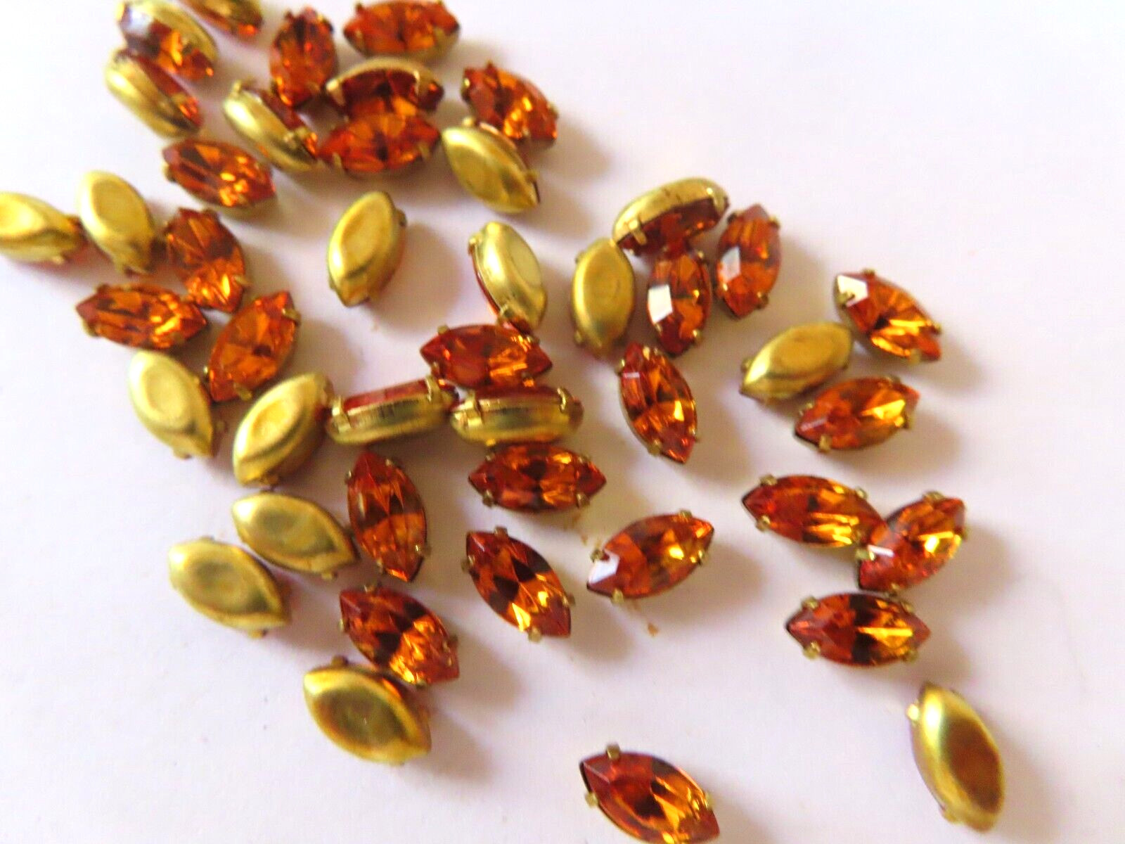36 Swarovski Navettes 8x4mm Topaz/Brass settings.