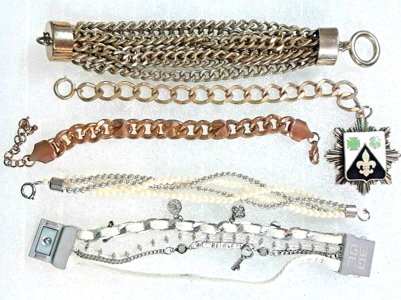 Chunky heavy bracelets. Copper color chain with spikes, gold tone pendant + more