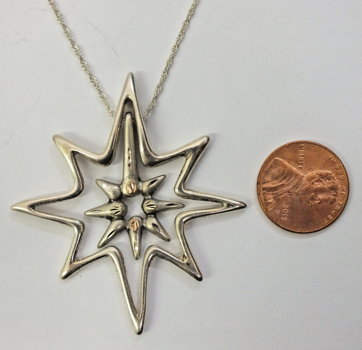 Landstrom’s Black Hills Gold Sterling Silver & 12K Gold Star Necklace w/ chain