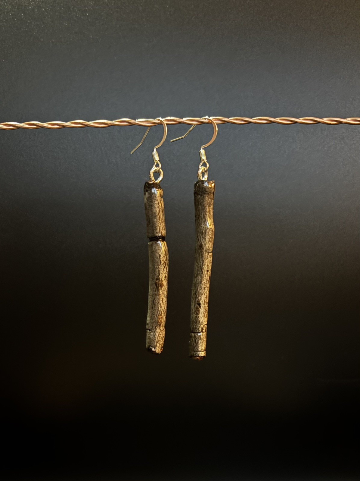 One of a kind jewelry made from real pieces of wood coated in resin