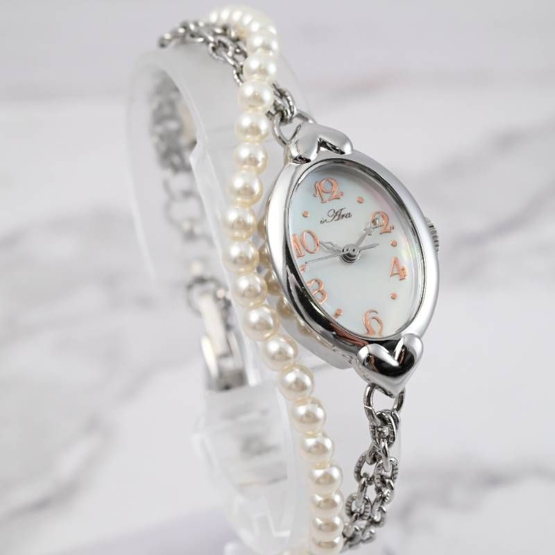 sara ladies’ wristwatch pearl bracelet watch oval shell dial heart motif silver