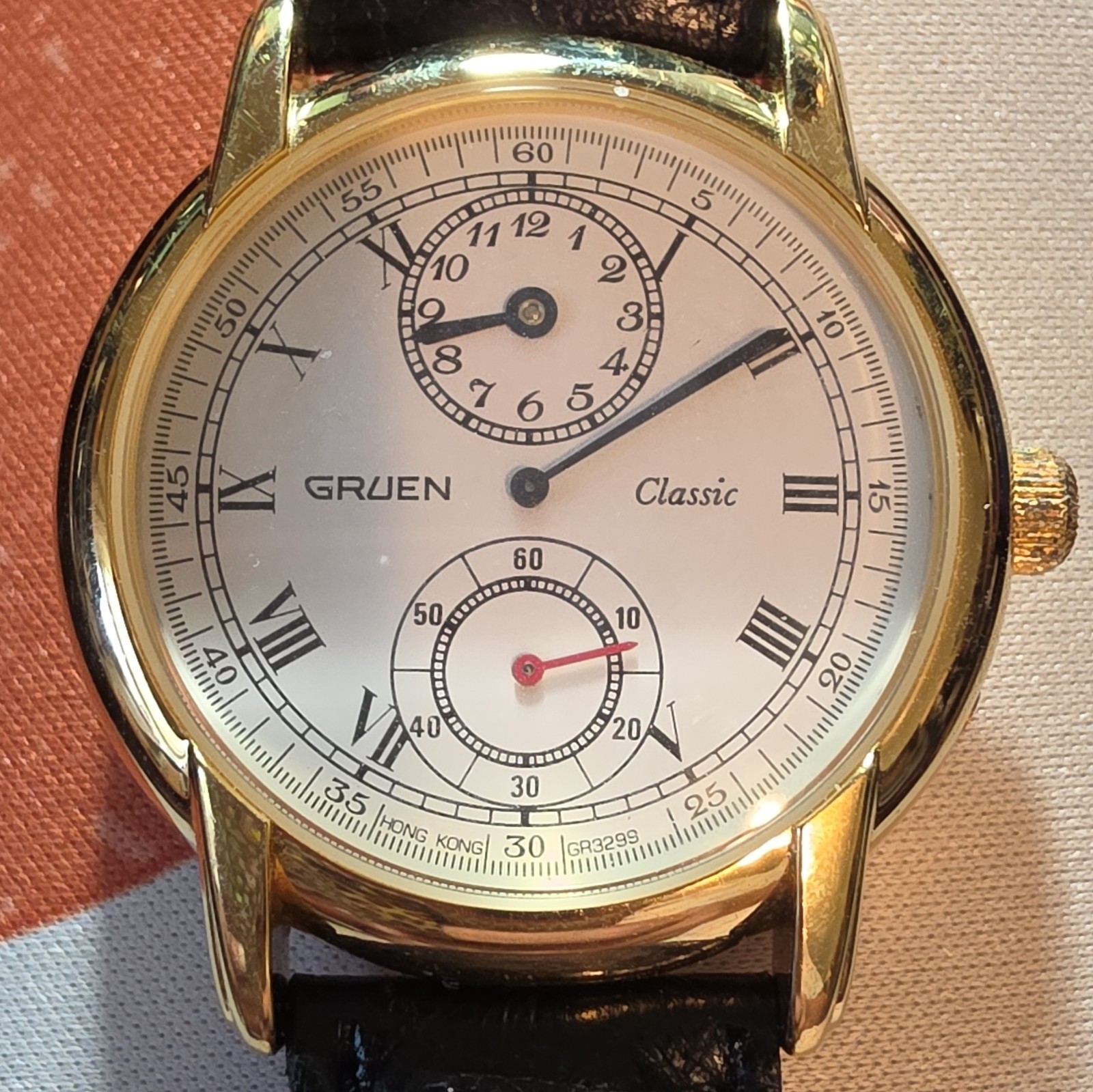 Gruen Classic Quartz White Roman Dial Gold Tone Steel Case Black Leather 33mm