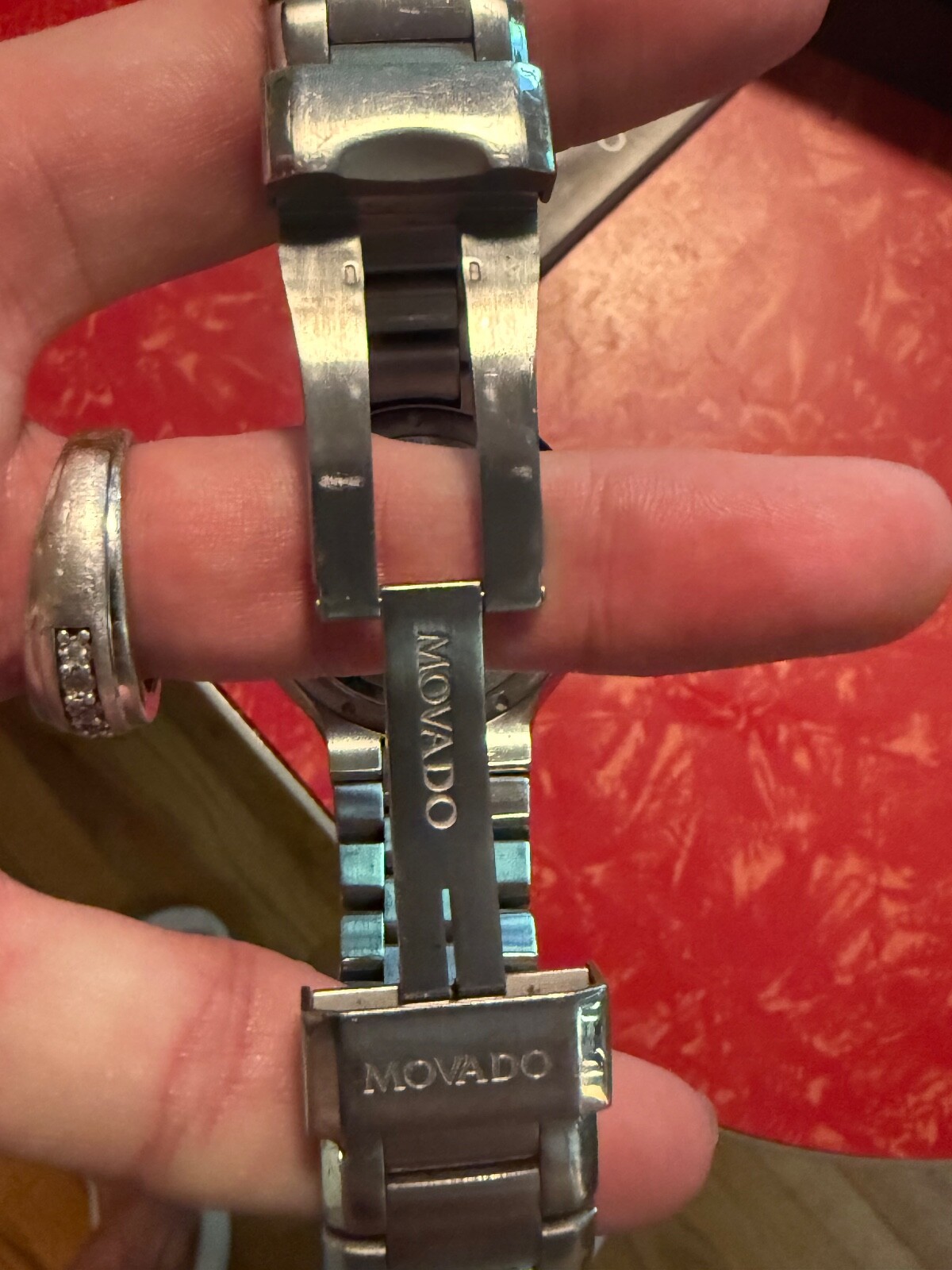 MOVADO 800 SERIES WATCH WITH BLCK BEZEL AND DIAMOND MAKERS – MENS WATCH