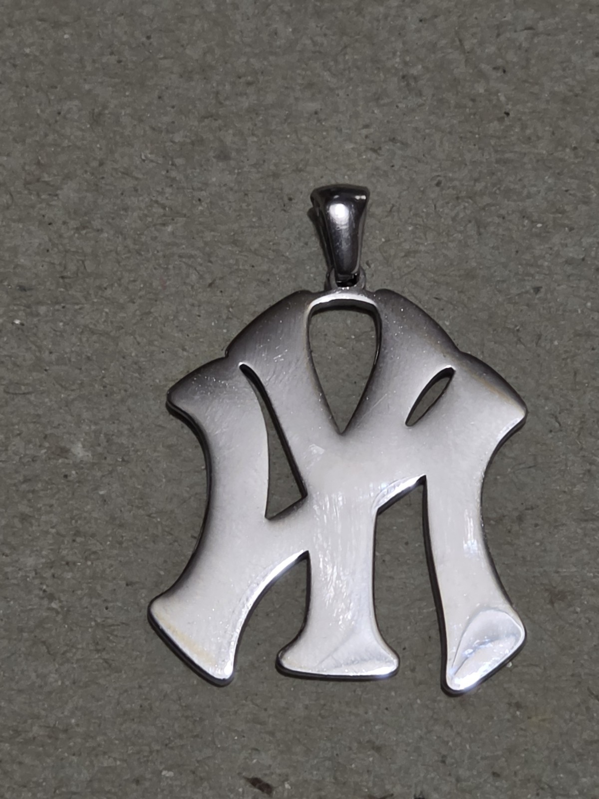 NY YANKEES BLUE NY STAINLESS STEEL CHARM Is 1.5″ High By 1″ Wide