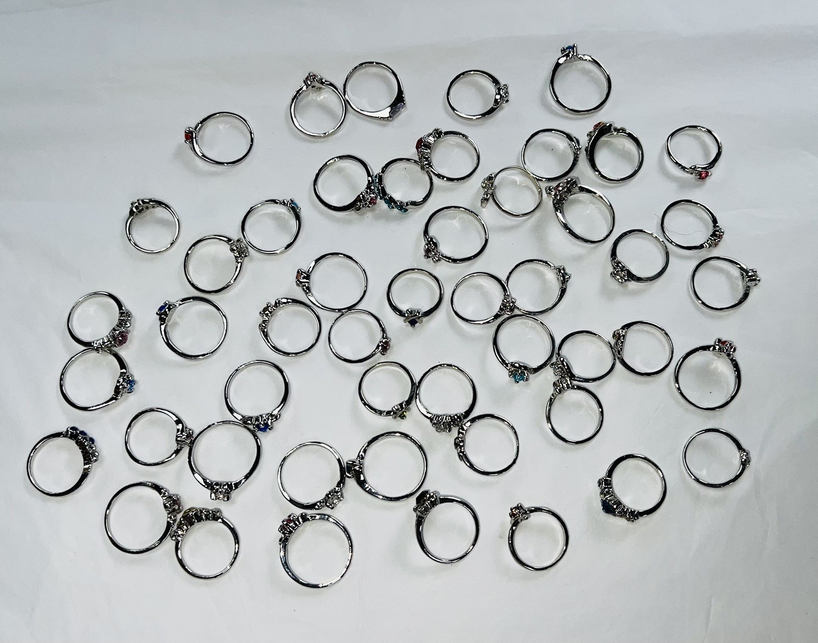 Bundle Of 50 Lovely Silver Coloured Rhinestone RINGS Single & Multiple Gem Stone