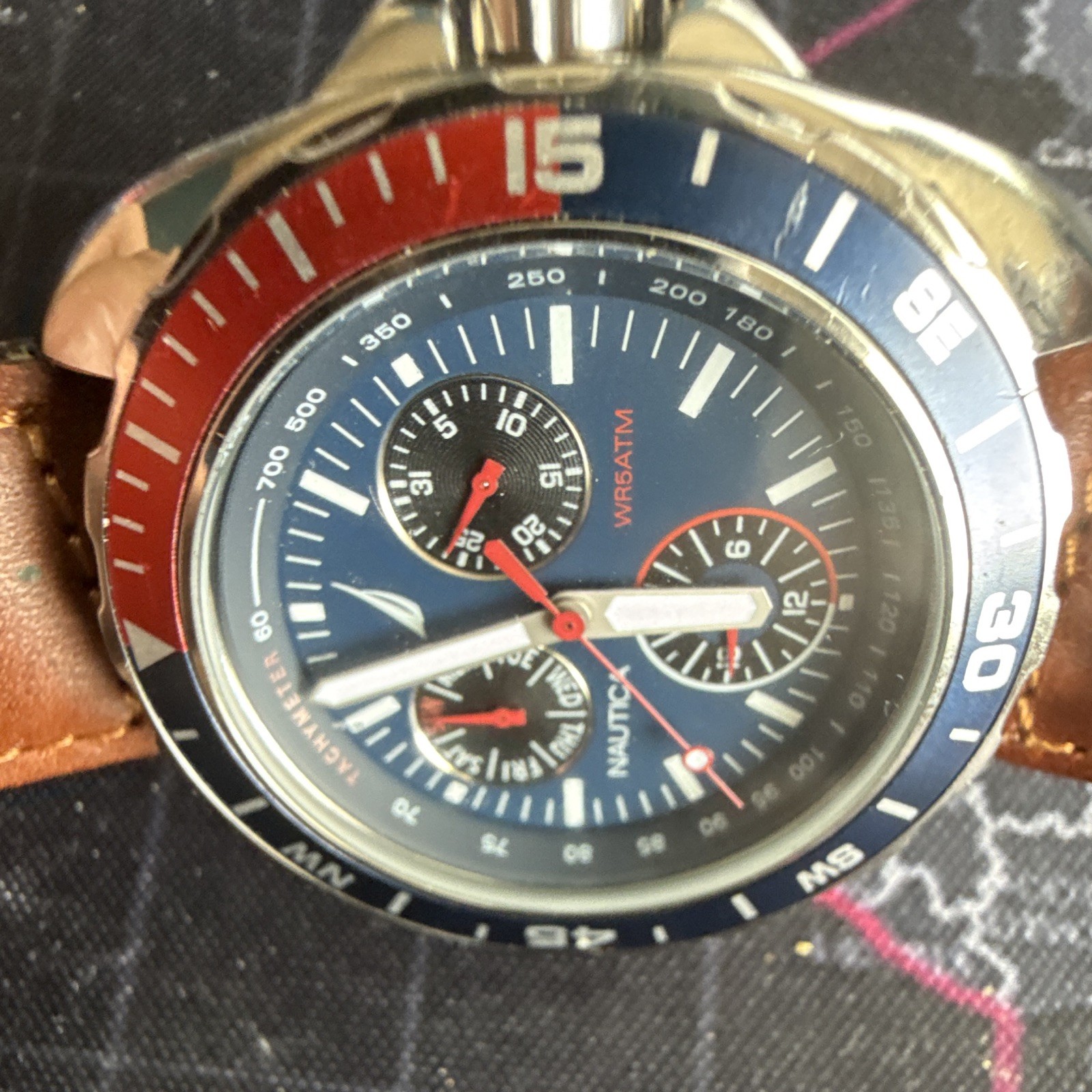 Nautica Men’s Quartz Sport Chronograph Tachymeter Blue Dial Red/Blue Bezel