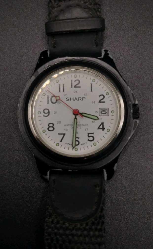 Sharp SHP-1607 Water Resistant to 100 feet Wristwatch. Needs battery.