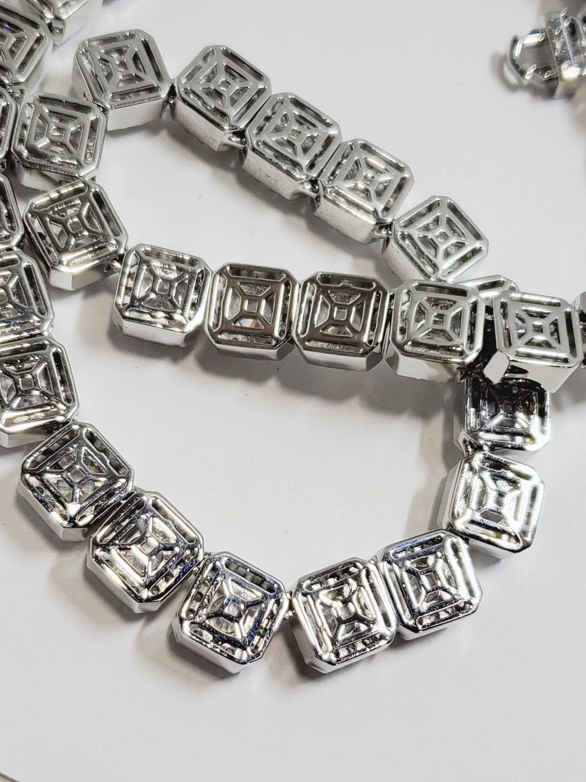 The Jewelry Plug Clustered Tennis Necklace in White Gold Plating