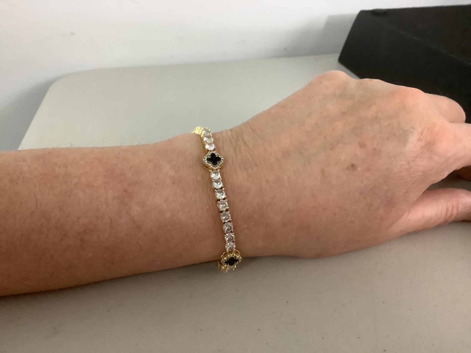 Imperium 18k gold plated CZs four leaf clover black enamel tennis bracelet 7″