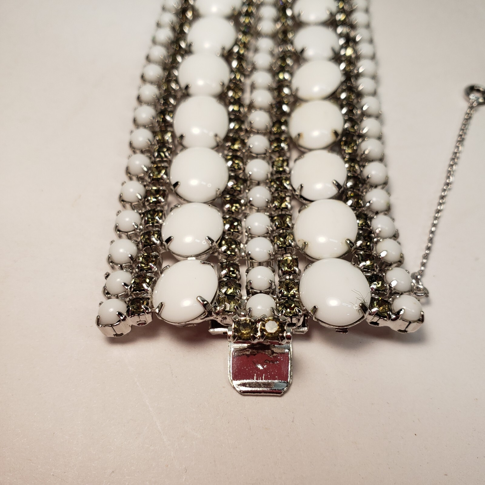 Milk Glass Bracelet With Crystal Rhinestones, 9 Rows. 7in Long 2in Wide