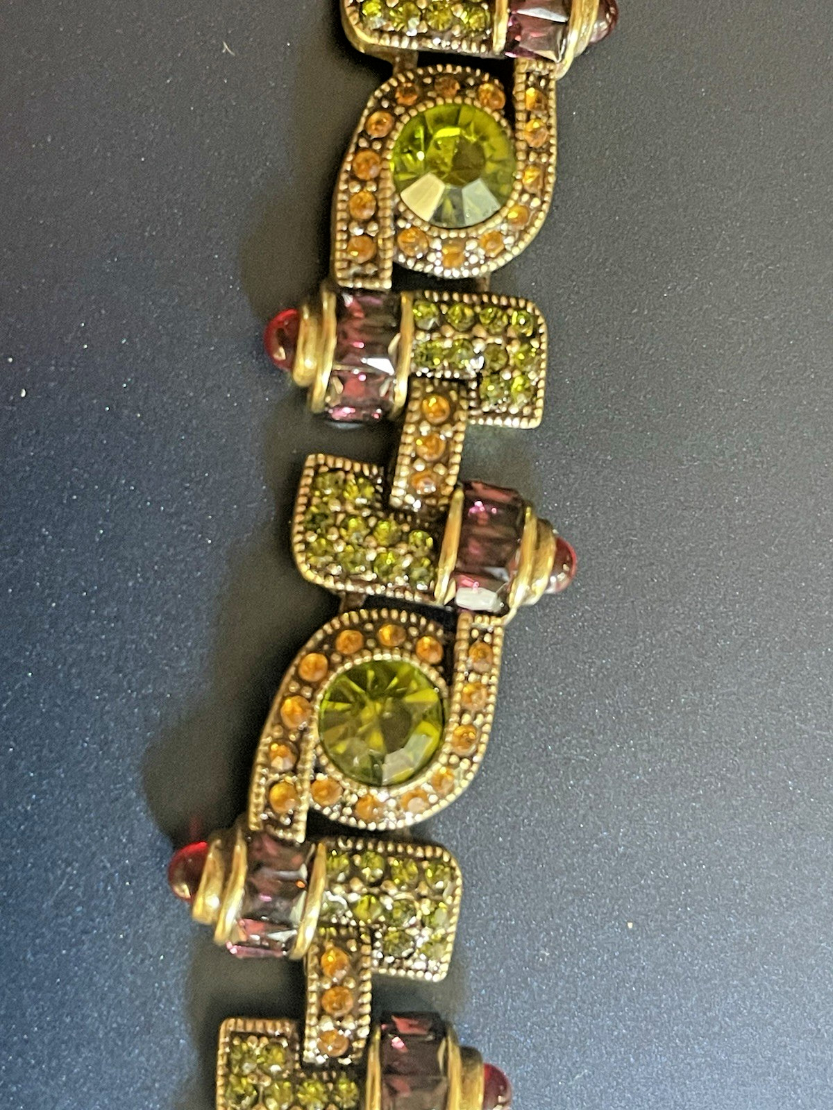 New Heidi Daus Bracelet in Original Packing. Olive Green, Red, Yellow Crystals.
