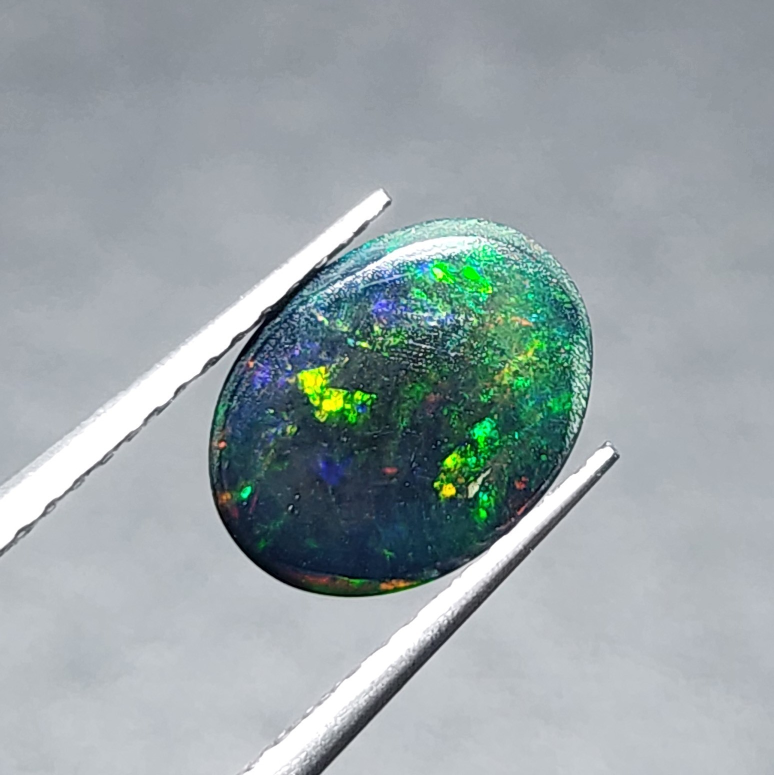 Natural Welo Black Opal Ethiopia Oval Cabochon Vivid Green Fire Gemstone 1.20Ct