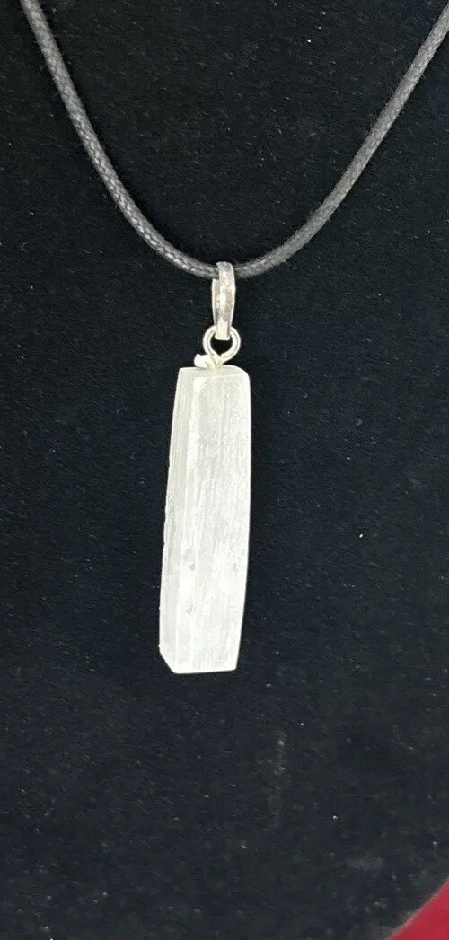 Selenite top drilled pendant with silver colored bail and adjustable cord