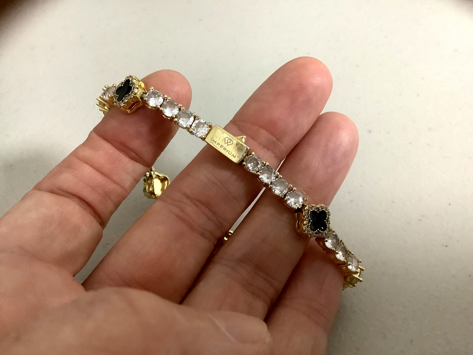 Imperium 18k gold plated CZs four leaf clover black enamel tennis bracelet 7″