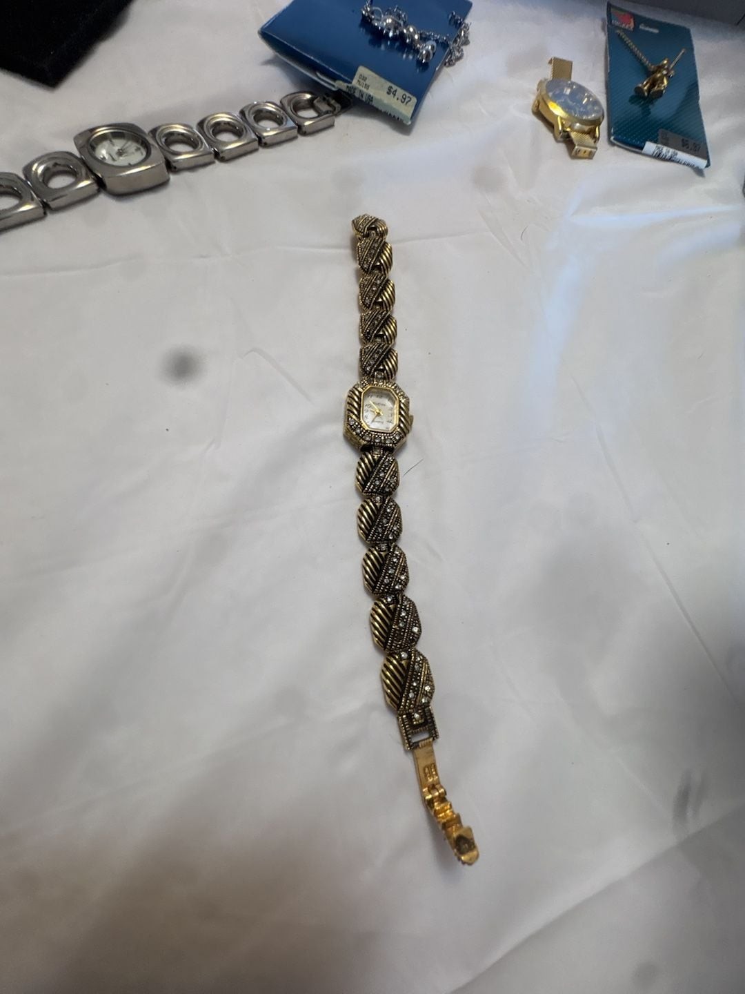 Chico’s Ladies Gold-Tone Crystal Accented Bangle Quartz Watch