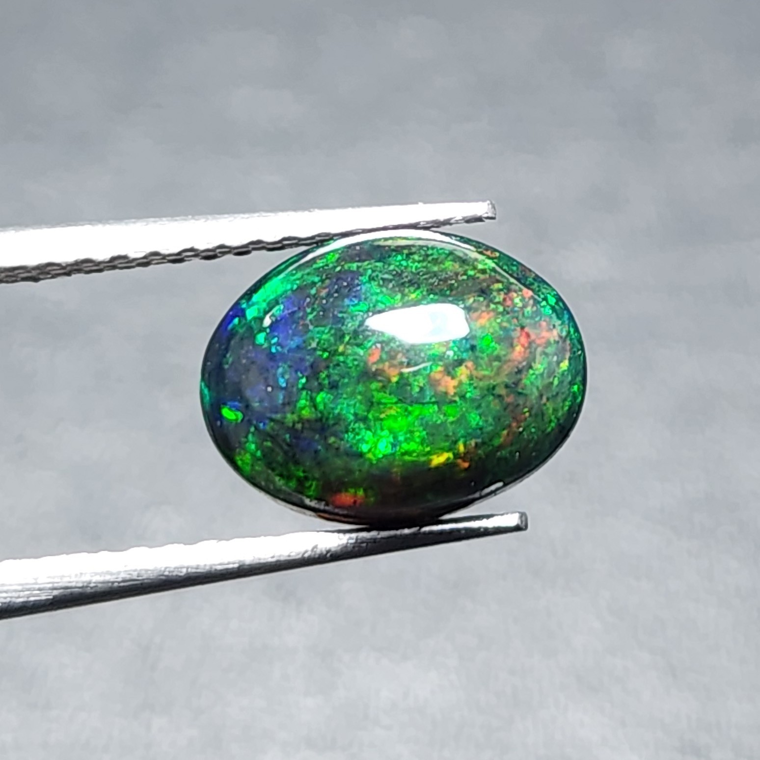 Natural Welo Black Opal Ethiopia Oval Cabochon Vivid Green Fire Gemstone 1.20Ct
