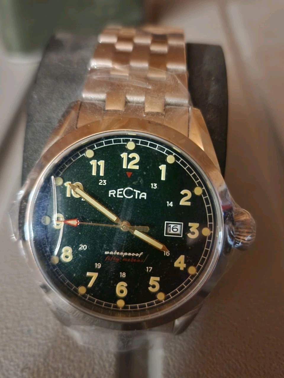 Recta mens watch has stainless bezel and band. Very classy