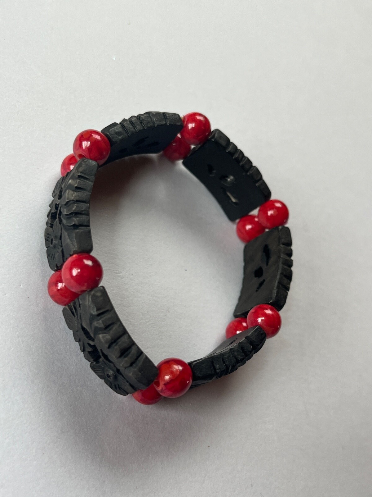 Alternating Carved Black Floral Rectangle & Red Round Plastic Beads Stretch Brac