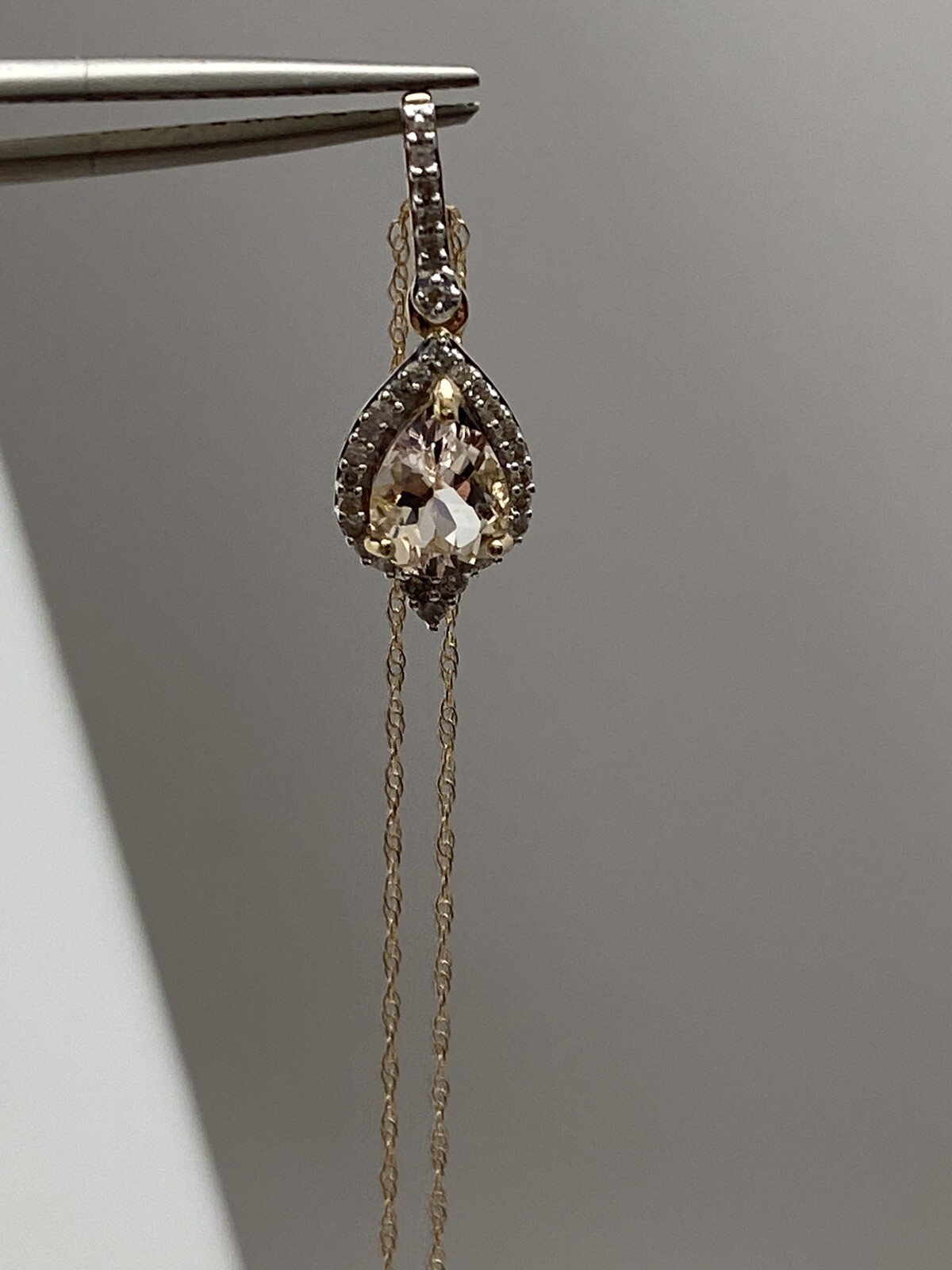10K Yellow Gold Pear Shape Morganite and 0.11ct twt. Diamond Pendant with Chain