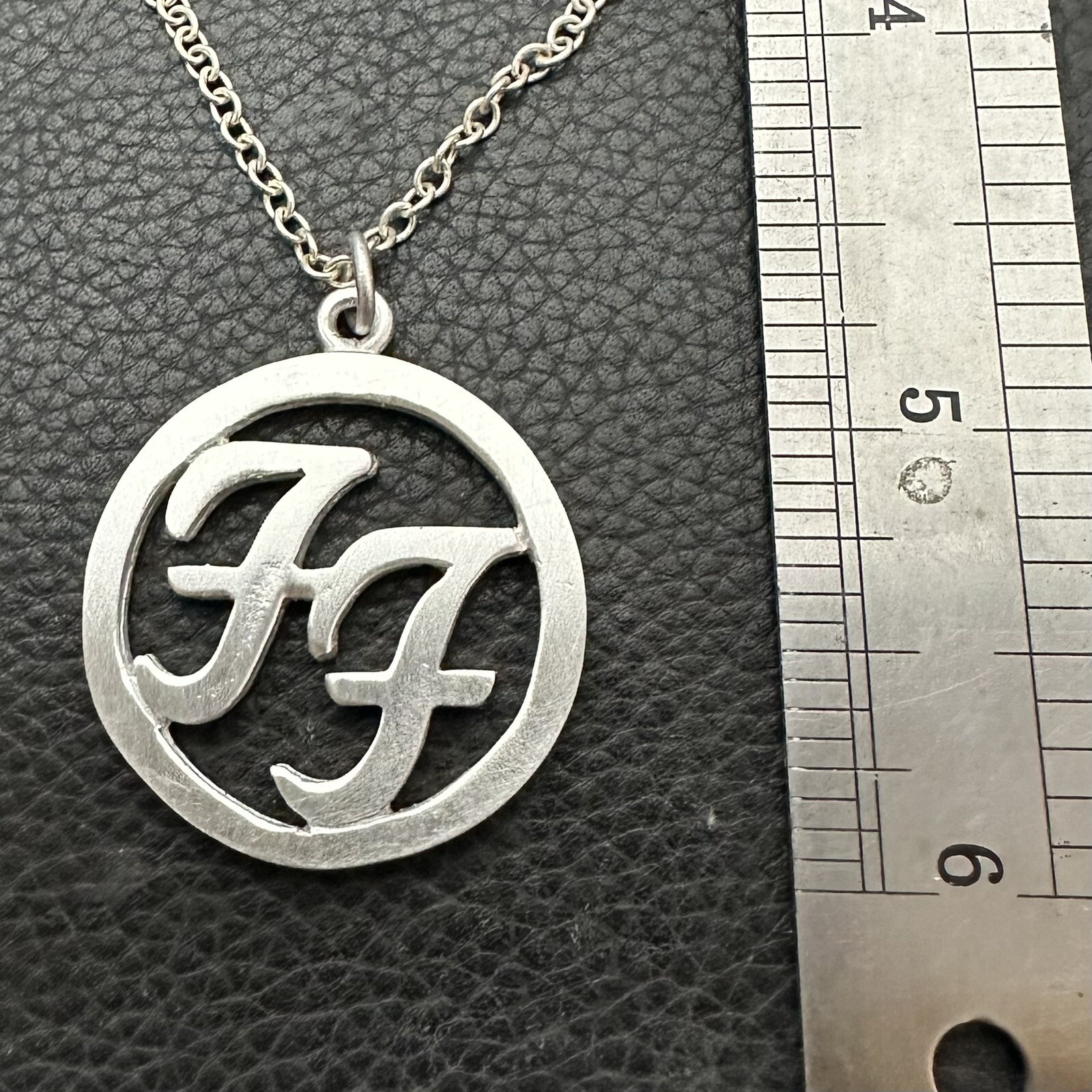 MJG STERLING SILVER FOO FIGHTERS PENDANT. CIRCLE. WITH CHAIN. DAVE GROHL