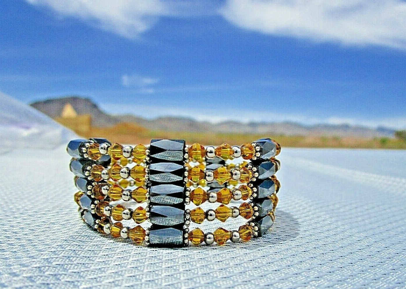 H.C. Magnetic Wrap, 36″, Amber & Hematite Beads, Gold Tone Spacers