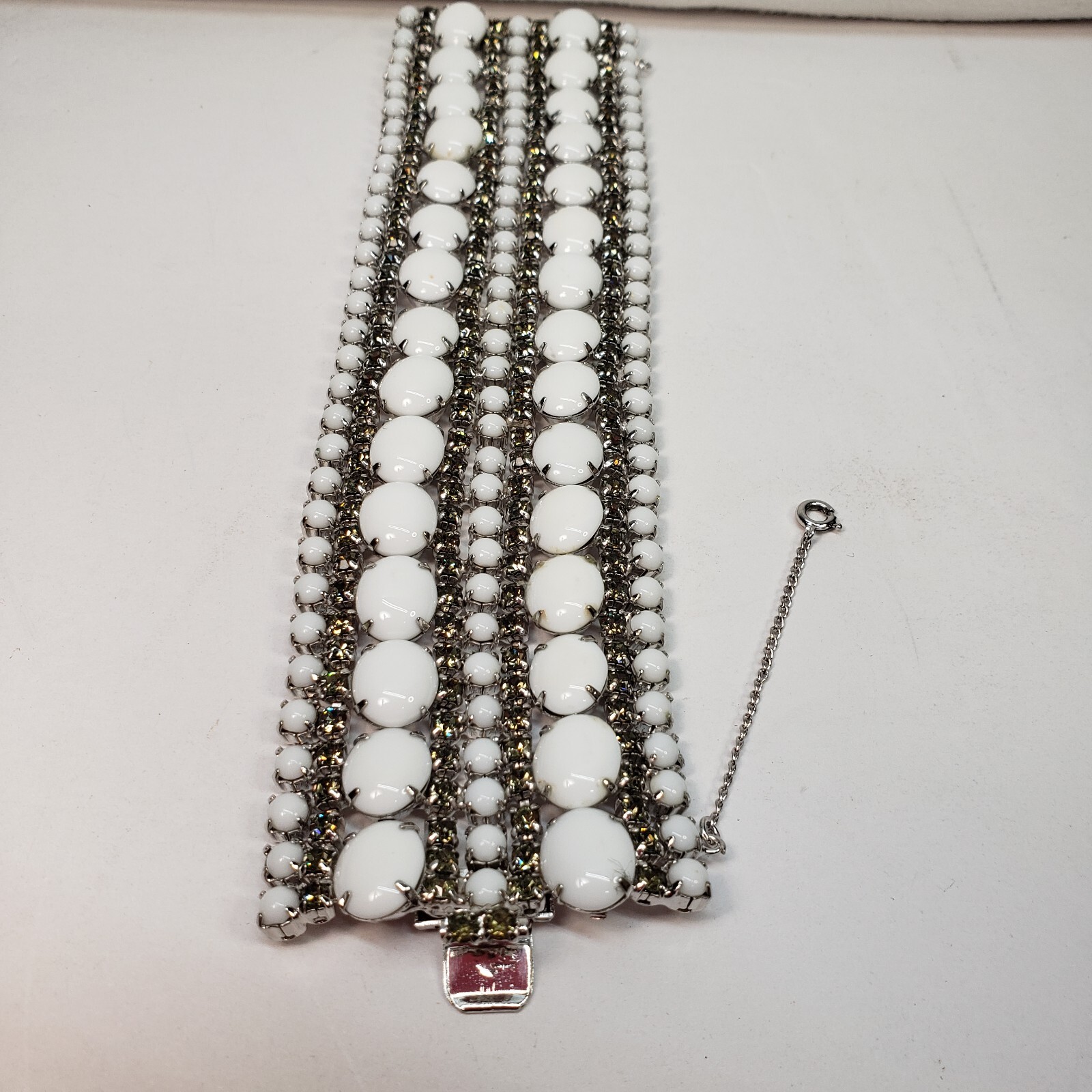 Milk Glass Bracelet With Crystal Rhinestones, 9 Rows. 7in Long 2in Wide