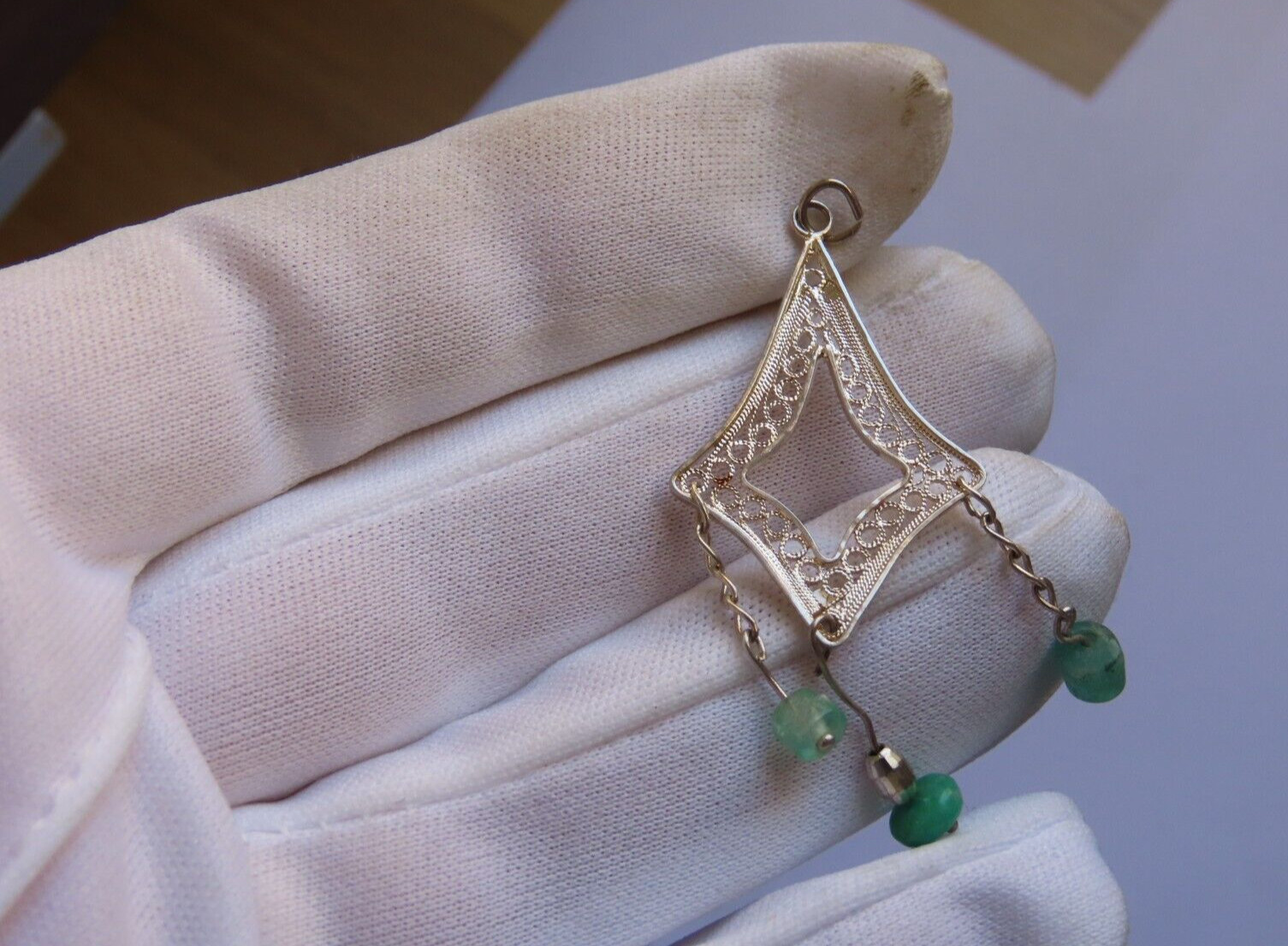 Handmade filigree silver pendant with Colombian emeralds