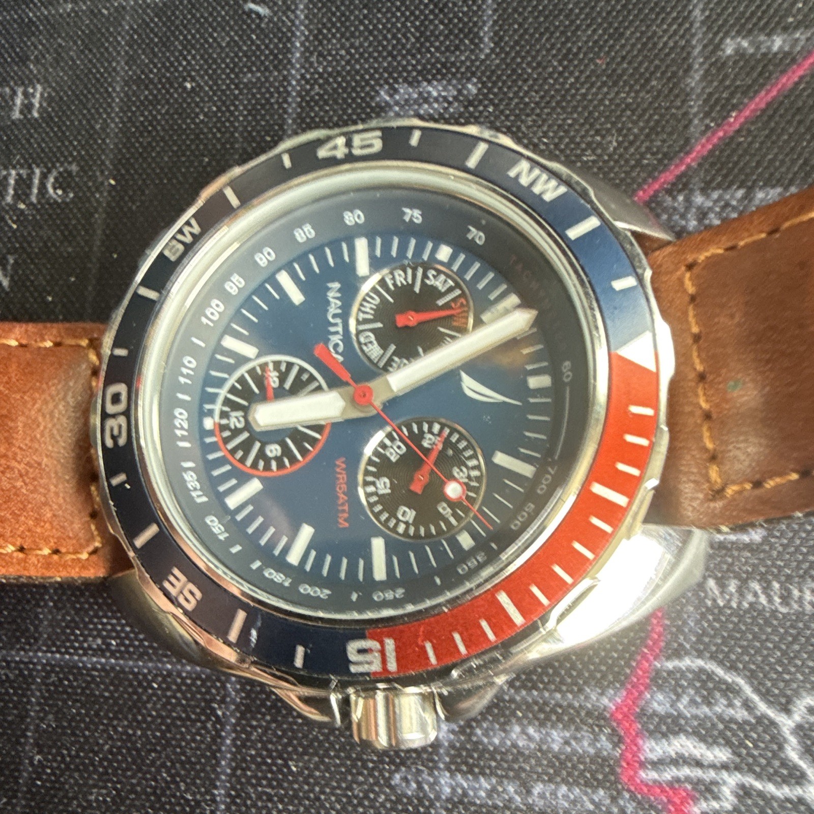 Nautica Men’s Quartz Sport Chronograph Tachymeter Blue Dial Red/Blue Bezel