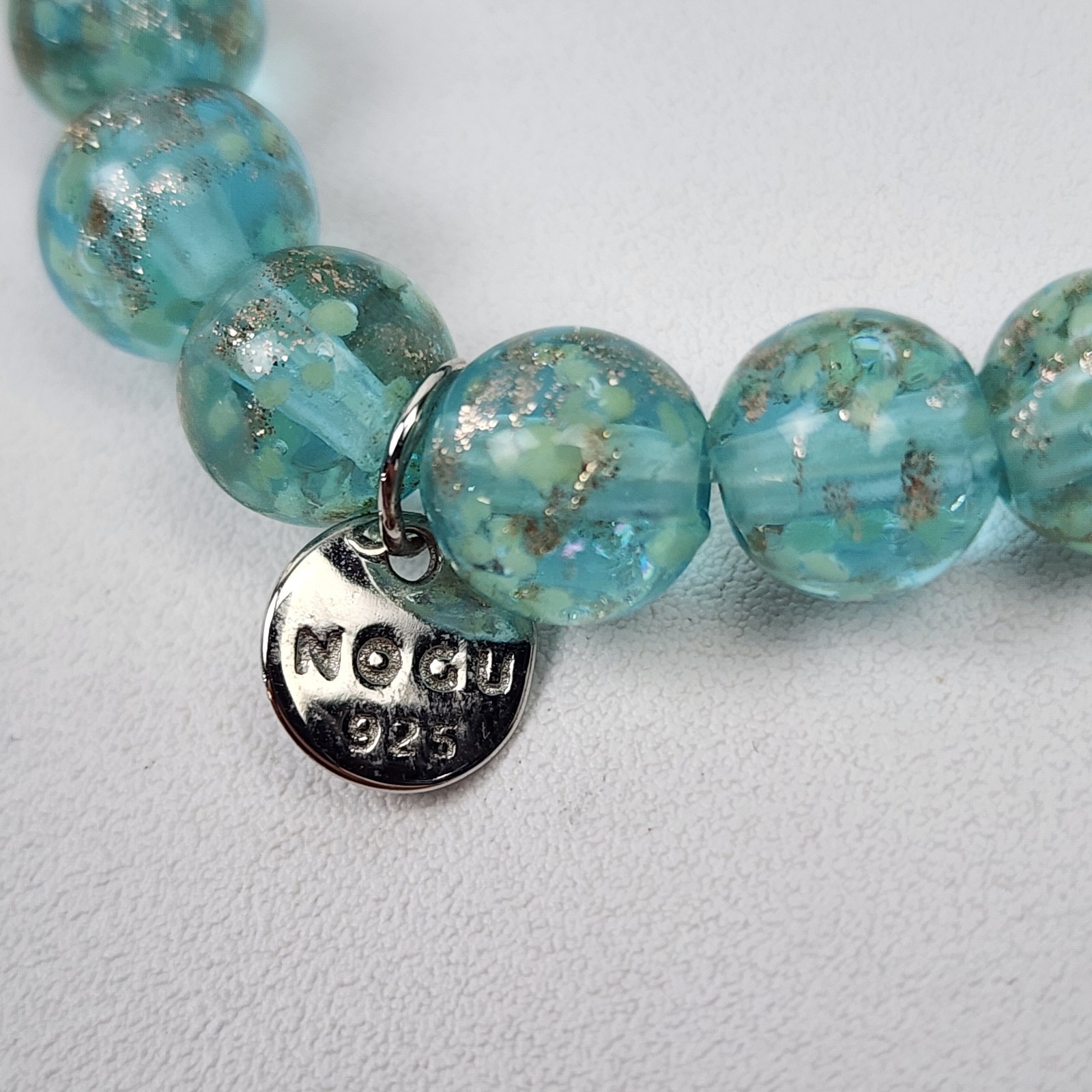 Nogu Teal .925 Sterling Firefly Glow in the Dark Glass Stretch Bracelet NIB