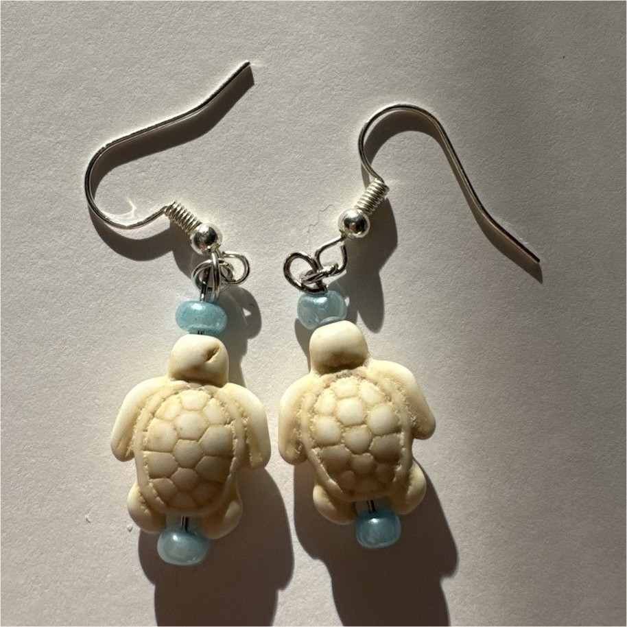 Handcrafted silver turtle dangle earrings with blue beads