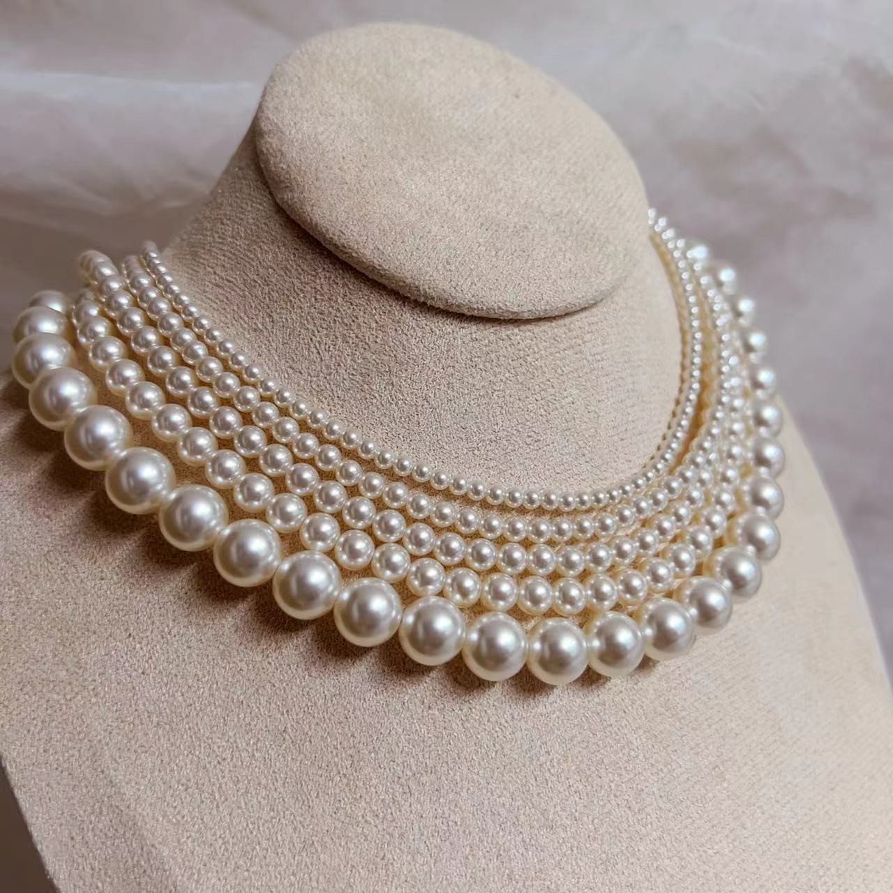 650 Warm White Perfectly Round High-Intensity Pearl Necklace