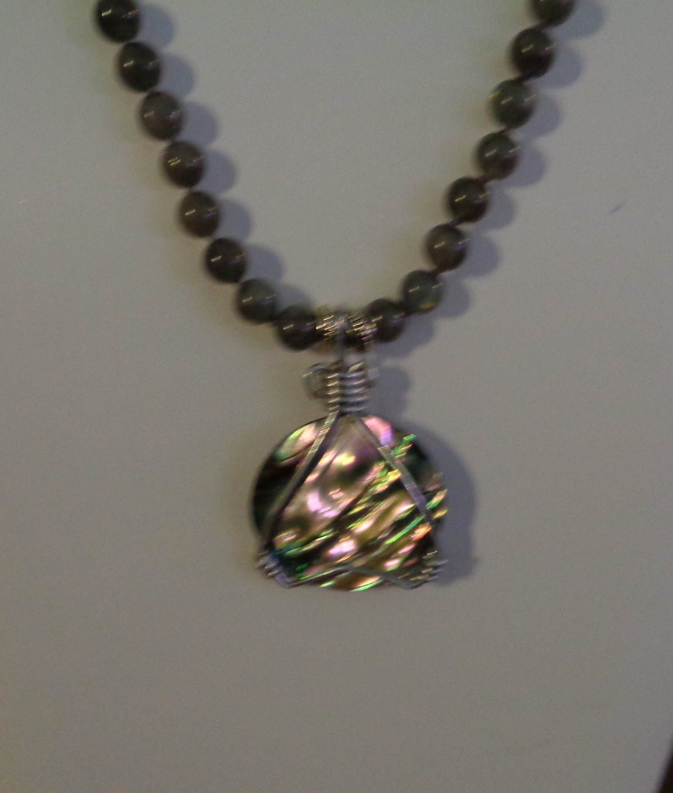 Artisan crafted, gorgeous, aluminum wrapped Paua pendant, on 19” Labradorite str