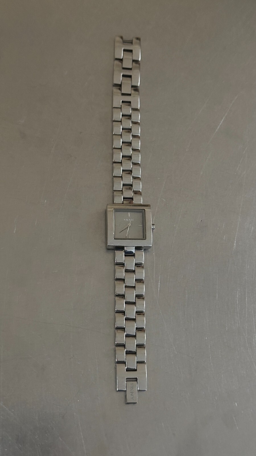 DKNY Watch Women’s Analog Square Silver Tone Quartz Water Resistant 7 inch 22 mm