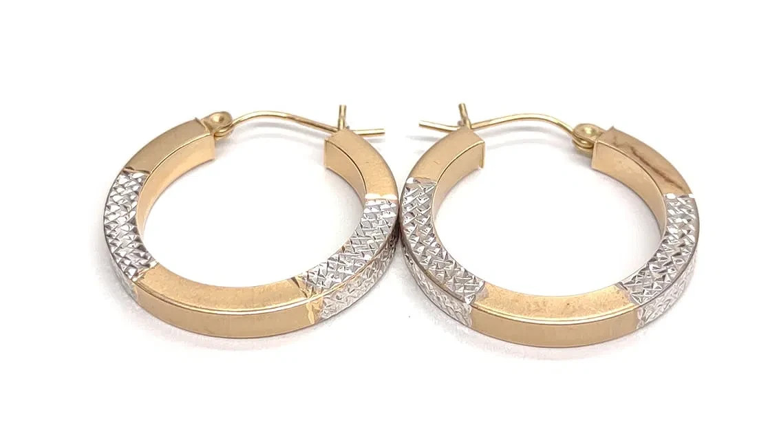 14 karat white and yellow gold hoop earrings. 25mm diameter