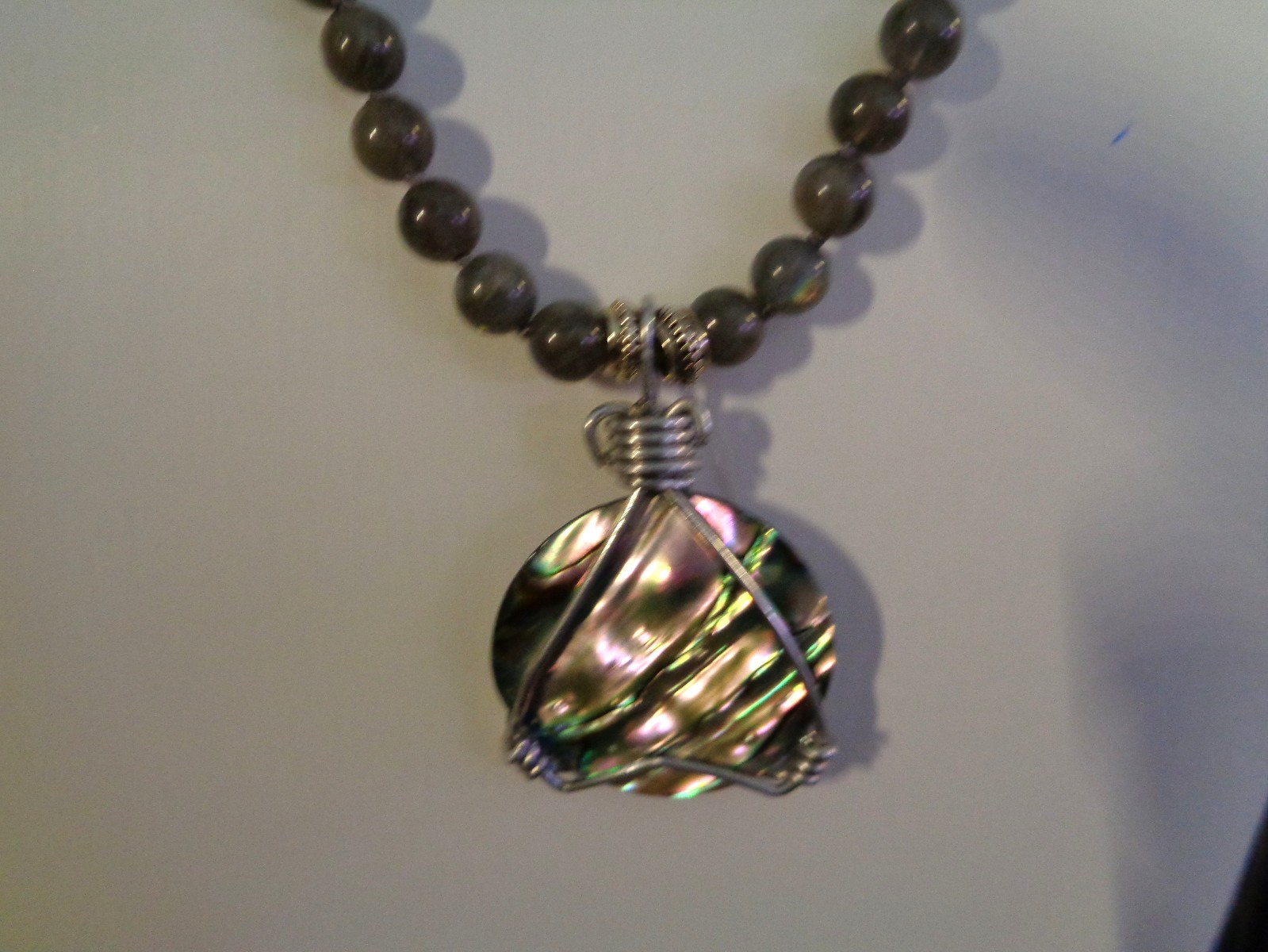 Artisan crafted, gorgeous, aluminum wrapped Paua pendant, on 19” Labradorite str