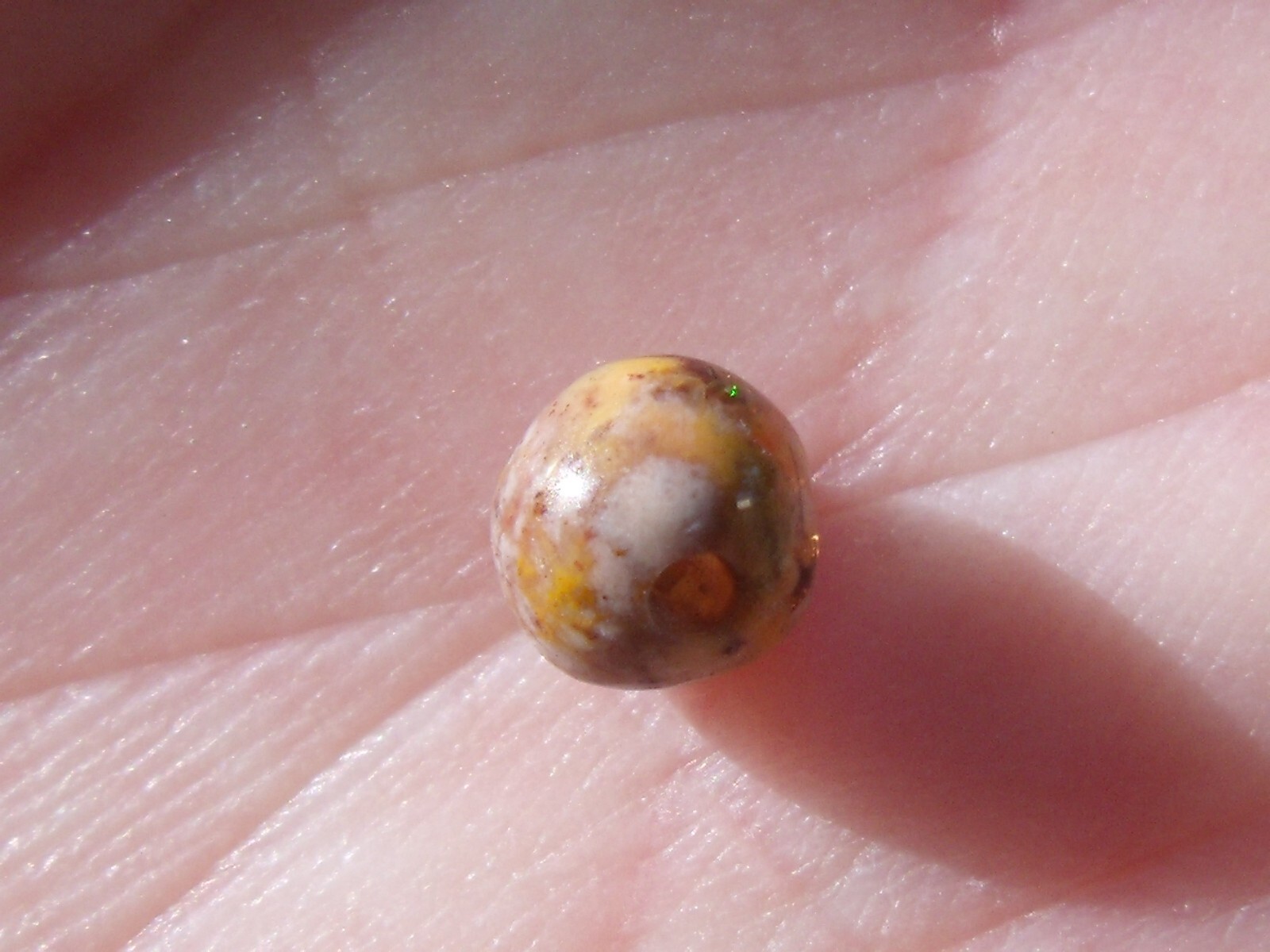 0.82 Ct. Round Cut Mexican Cantera fire opal bead.