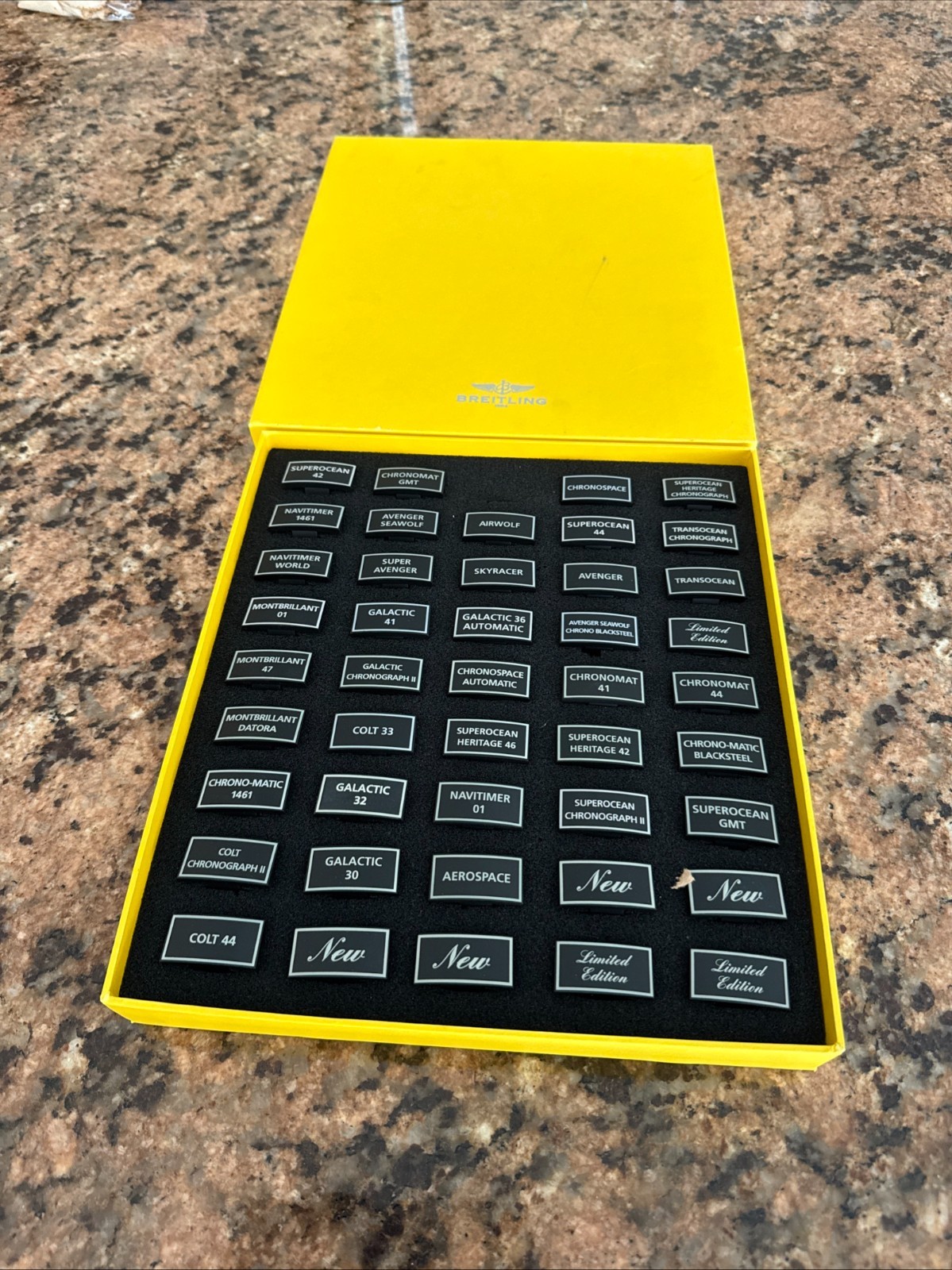 GENUINE BREITLING BOX WITH 44PCS OF VARIES PLASTIC PLAQUES FOR DISPLAY WATCHES