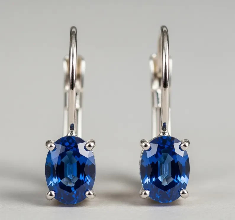 Stunning Lab-Created Oval Sapphire Lever Back Earrings in Sterling Silver
