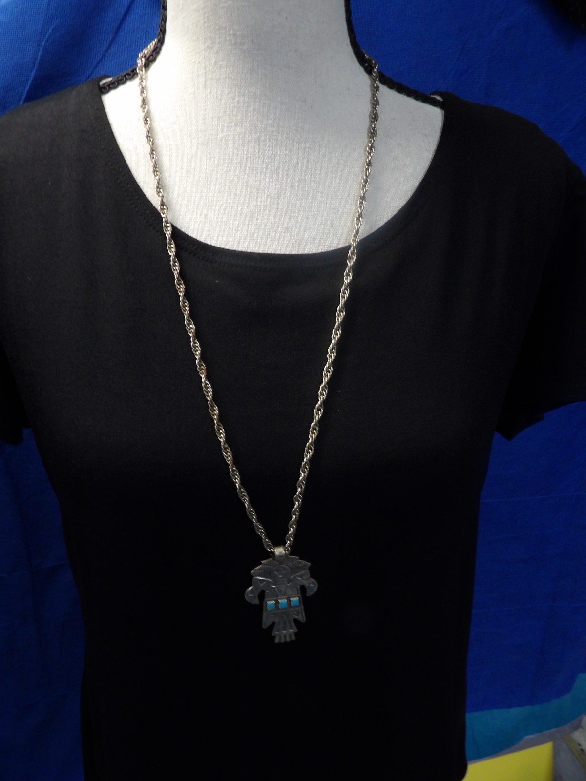 Navajo Kachina Totem Turquoise BRanded Nickle Silver Bell w/28″ Braided Chain.