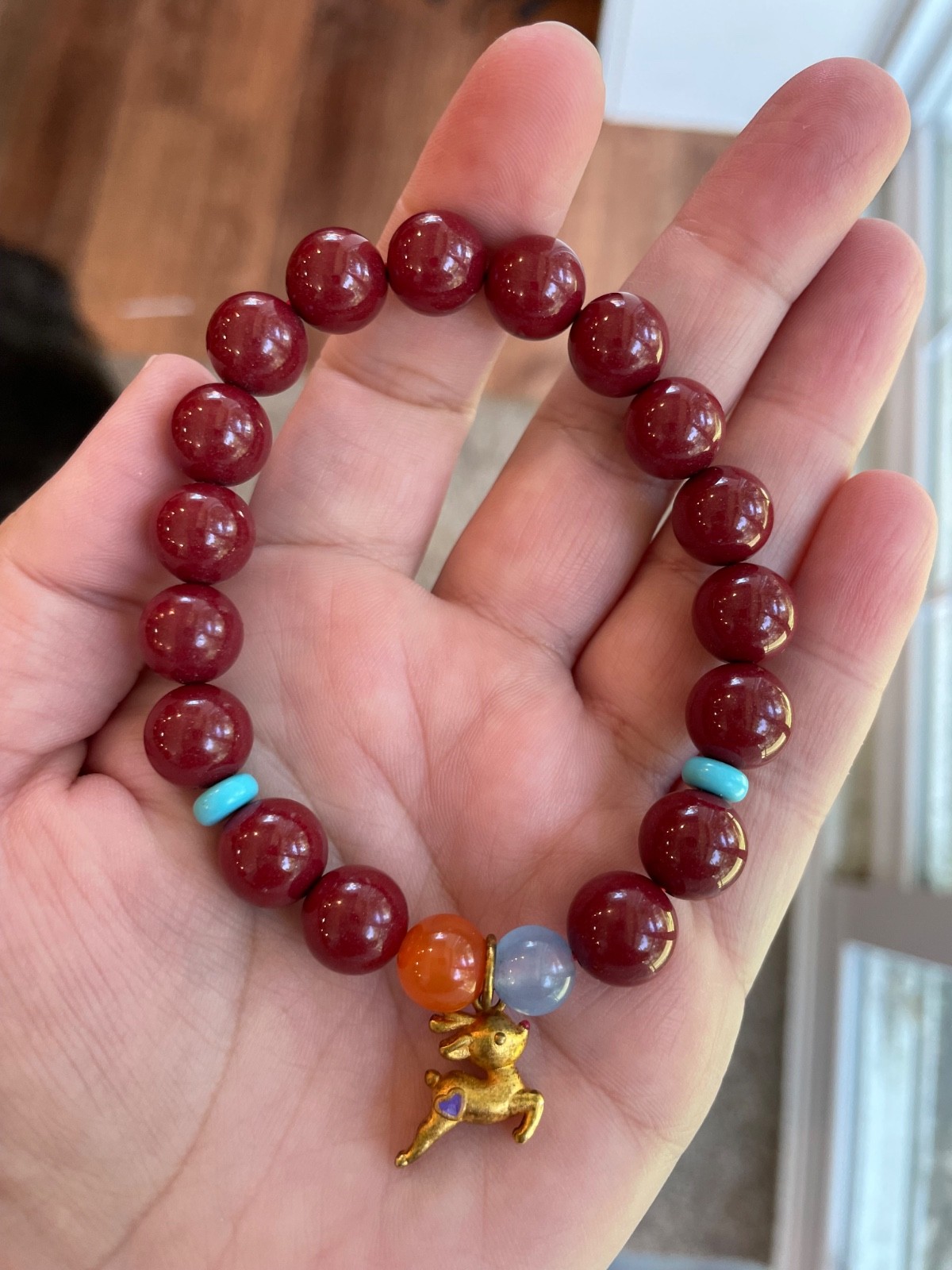 Cinnibar bracelet with deer charm (10.6mm)